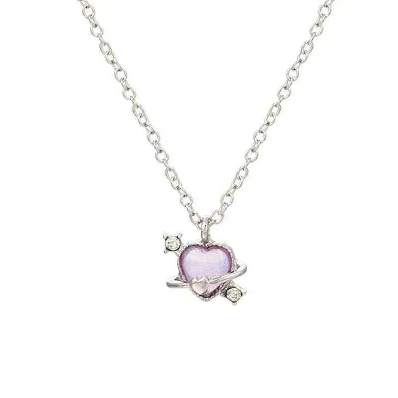 Silver-tone necklace with small pink heart pendant and tiny crystal accents