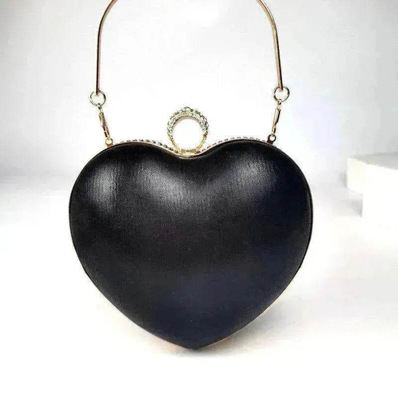 Black heart-shaped satin handbag with metal ring clasp and loop top handles