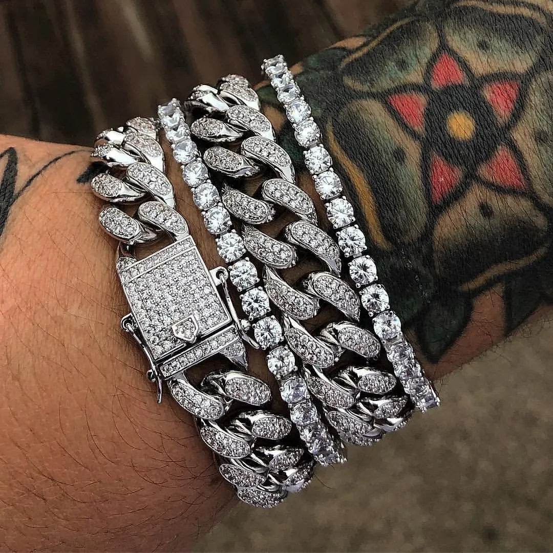 Silver diamond Cuban link bracelet on wrist, multiple oval rows and square clasp