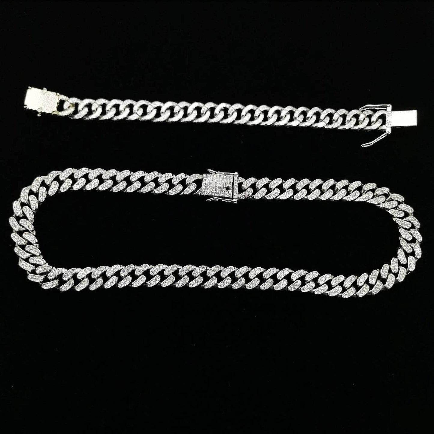 Silver diamond Cuban link bracelet with rectangular clasp on dark background.