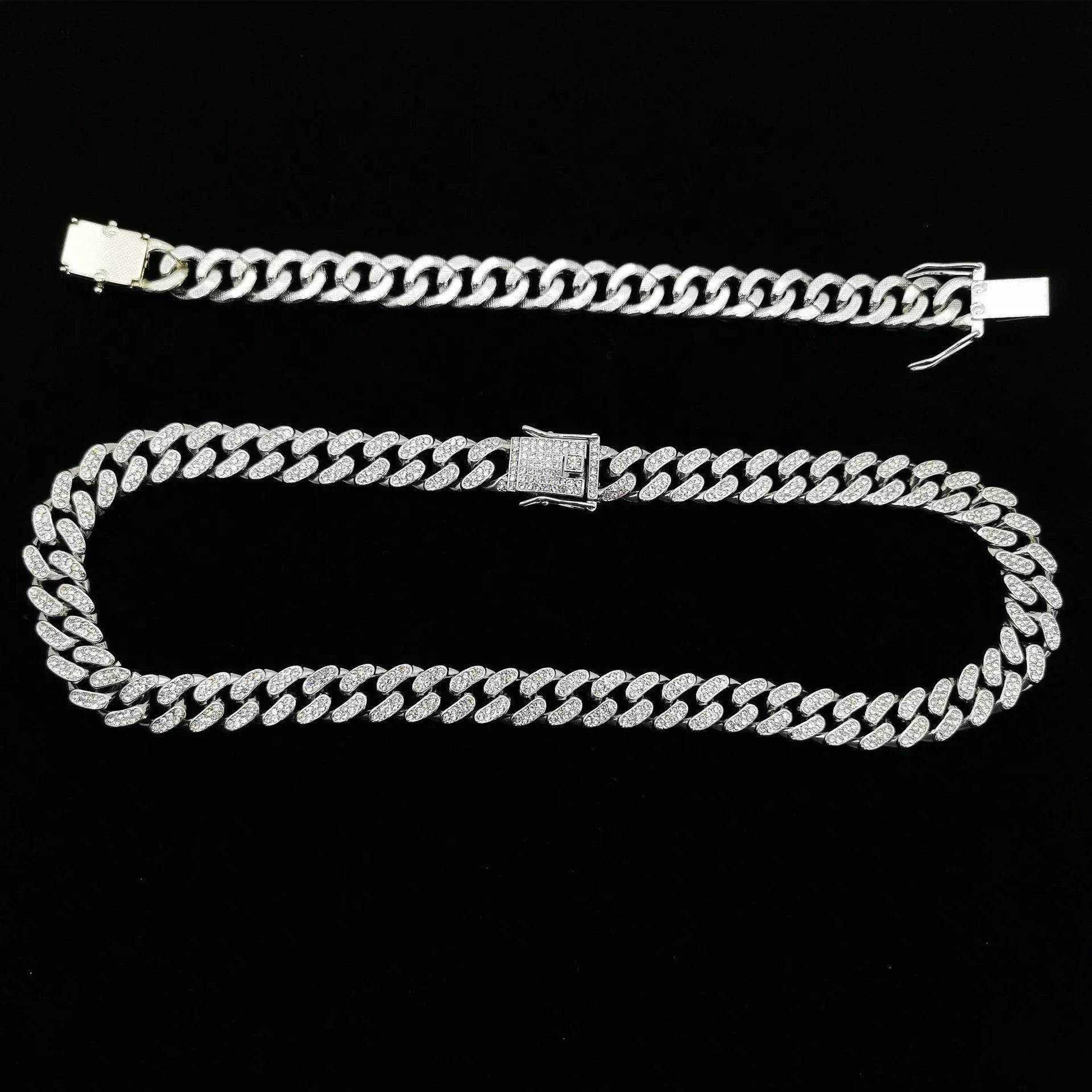 Silver diamond Cuban link bracelet with rectangular clasp on dark background.
