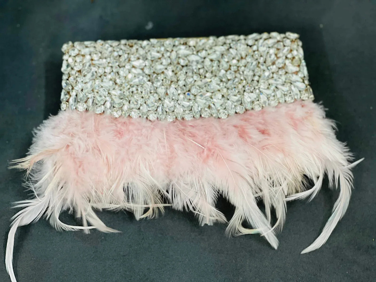HOPE Feather Clutch close-up: crystal-embellished flap with pink feather trim