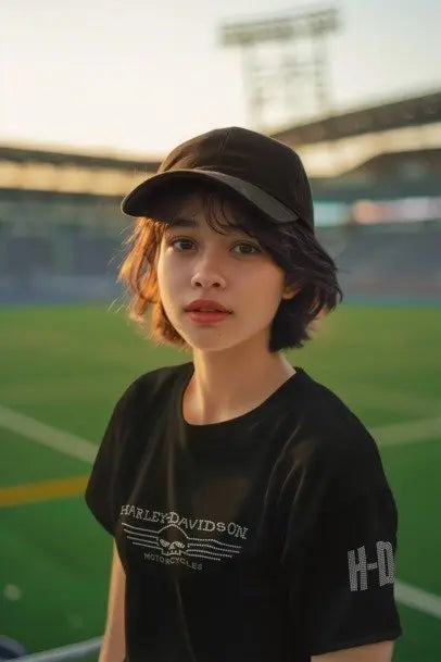 Person wearing a black Harley Davidson t-shirt on a sports field