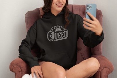 Black long-sleeve sweatshirt with rhinestone-style crown Queen graphic
