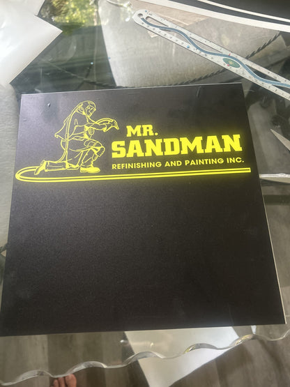 Black custom sign with yellow Mr. Sandman logo and Refinishing and Painting Inc.