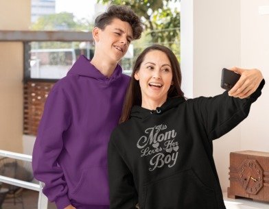 Black long-sleeve hoodie with rhinestone 'Mom Loves Her Boy' chest logo