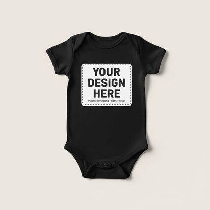 Black short-sleeve baby onesie with 'YOUR DESIGN HERE' front label