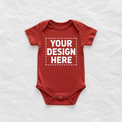 Red short-sleeve baby onesie with 'YOUR DESIGN HERE' front print